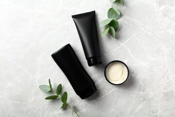 Wall Mural - hair care beauty products for men. shampoo bottle, conditioner tube, hair balm jar on stone table. f