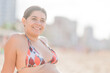 © Sangiao_Photography - Summer Beach vacation. Latin middle aged female on swimwear confident body inclusivity wellbeing.