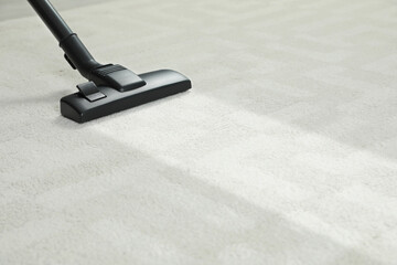 Canvas Print - Hoovering carpet with vacuum cleaner, space for text. Clean trace on dirty surface