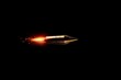 Bullet in flight after firing. Background with selective focus. AI generated, human enhanced