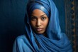 Tuareg woman in authentic national blue dress. Background with selective focus. AI generated, human enhanced
