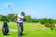 © CandyRetriever  - Asian senior man holding golf club hitting golf ball on fairway at country club in sunny day. Healthy retired elderly man golfer enjoy outdoor activity sport golfing at golf course on summer vacation