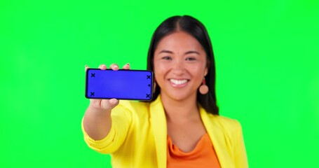 Sticker - Green screen, phone screen and woman face with thumbs up for yes, vote or social media review on studio background. Portrait, smile and asian lady with emoji hand or smartphone networking promo offer