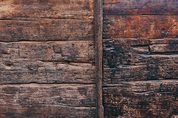 Wall Mural - Old weathered medieval wooden door gate detail as background