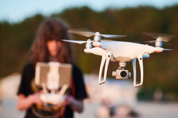 Wall Mural - drone operated by young man flying over an sea