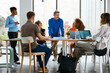 © Westend61 - Business colleagues discussing strategy at desk in office