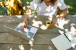 © Westend61 - Female freelancer working on laptop at table