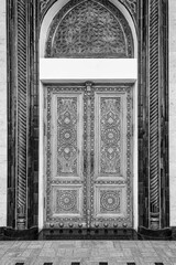 Wall Mural - Carved wooden doors with patterns and mosaics. Black and white.