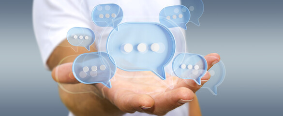 Wall Mural - Man touching with his fingers digital speech bubbles talk icons. Minimal conversation or social media messages floating in front of businessman hand. 3D rendering