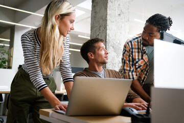 Programmers cooperating at IT company developing apps. People business work office concept