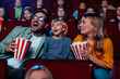 © bernardbodo - Excited family in movie theater.