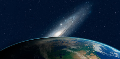 Wall Mural - view of the planet earth from space during a sunrise against the andromeda galaxy ( messier 31) 