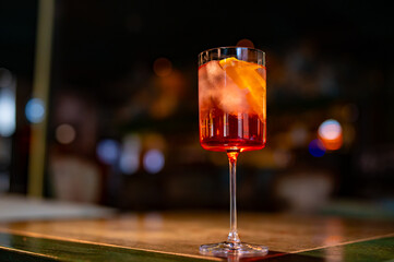 alcohol cocktail in a glass stands on a table in a bar or restaurant