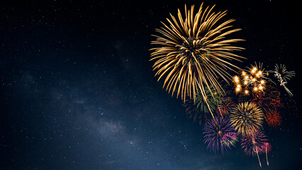 Wall Mural - Fireworks with blur milky way background