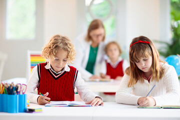 Wall Mural - Kids in school. Children in class.