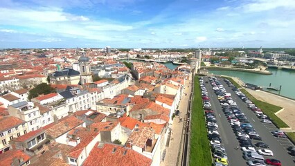 Wall Mural - Rooftops and Old Port of La Rochelle on a sunny day in France