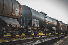 Transportation Tank Cars With Oil During Sunset. Railway Containers. Freight Railway Wagons. Railway Tank.