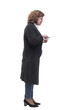 © ASDF - side view. mature woman using a digital tablet