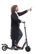 © ASDF - side view. confident woman with an electric scooter looking at the camera