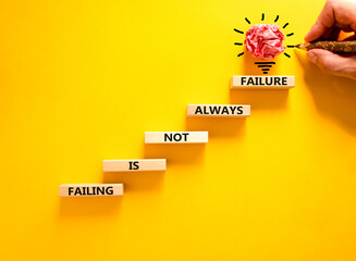 Wall Mural - Failure or failing symbol. Concept words Failing is not always failure on wooden block. Beautiful yellow table yellow background. Businessman hand. Business, failure or failing concept. Copy space.