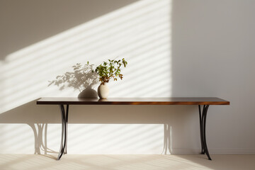 Table shadow background. Wooden table and white empty wall with plant shadows