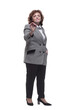 © ASDF - in full growth. Mature woman in a fashionable checked jacket.