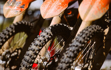 The Front Tires Of Three Off-road Motorbikes