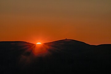 Wall Mural - red sunset over the mountains