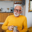 © Miljan Živković - One senior man sit at home in the kitchen with cup of tea or coffee