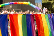 Bandeira símbolo do orgulho gay e publico ao fundo. 27ª edição, Parada do Orgulho LGBT+ de São Paulo, Brasil. 