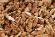 © AliRza - Close up organic nutmeat.  Crushed walnut background. Studio shot of crushed walnut. Selective focus area.