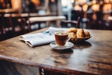 Cup Of Coffee With Newspaper And Croissants