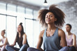 © Jasmina - Group of mixed race smiling women practicing yoga in the gym