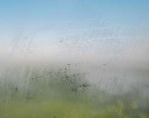 condensation on clear glass window in panoramic bathroom or shower room. water drops and condensed s