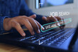 © AREE - New graduate man use laptop to find a job or job search and job finding work on the internet or job application website. we are hiring concept.