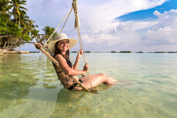 Canvas Print - Woman on swing at hammock