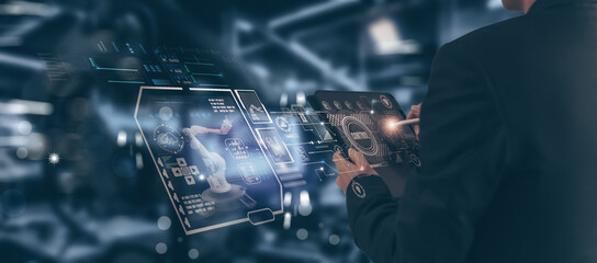Wall Mural - concept industry 4.0 engineer using smart tablet device monitoring system software in factory, contr