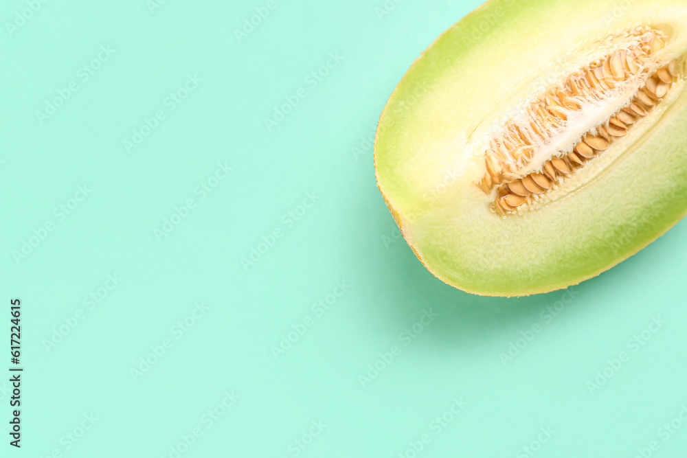 Piece of sweet melon on turquoise background