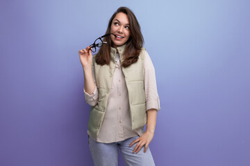 Canvas Print - young lady brunette in casual took off her glasses from her face during a break in the office