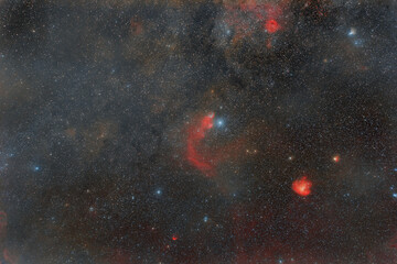 Wall Mural - photo of outer space. soft focus. lots of small stars all over the frame. foggy objects. red nebulae