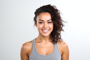 Wall Mural - Portrait of a beautiful young woman smiling and looking at the camera