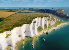 Aerial View Of Limestone Cliffs And Stacks With Countryside At Old Harry Rocks In Dorset UK