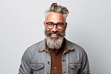 Portrait Of Handsome Mature Man With Grey Hair And Beard Wearing Eyeglasses