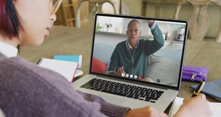 Canvas Print - Composition of asian schoolgirl on laptop online learning with african american schoolboy