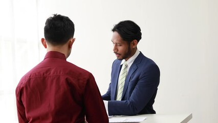 Poster - Two business men are discussing business together, they have a business meeting, a meeting of business partners at a start-up company, an agreement and discussion on a plan for growing a company.