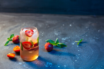 Wall Mural - refreshing strawberry cocktail with ice cubes. strawberry soda on dark background