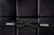 Dress code concept. Bow tie on black leather texture. Business. Lifestyle. B