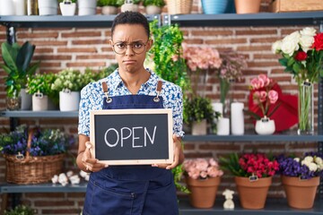 Sticker - African american woman working at florist holding open sign depressed and worry for distress, crying angry and afraid. sad expression.