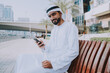 © oneinchpunch - Beautiful middle eastern man wearing kandora traditional outfit in Dubai. Portraits in the emirates