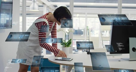 Sticker - Animation of radars, graphs and computer language over asian woman using digital tablet in office